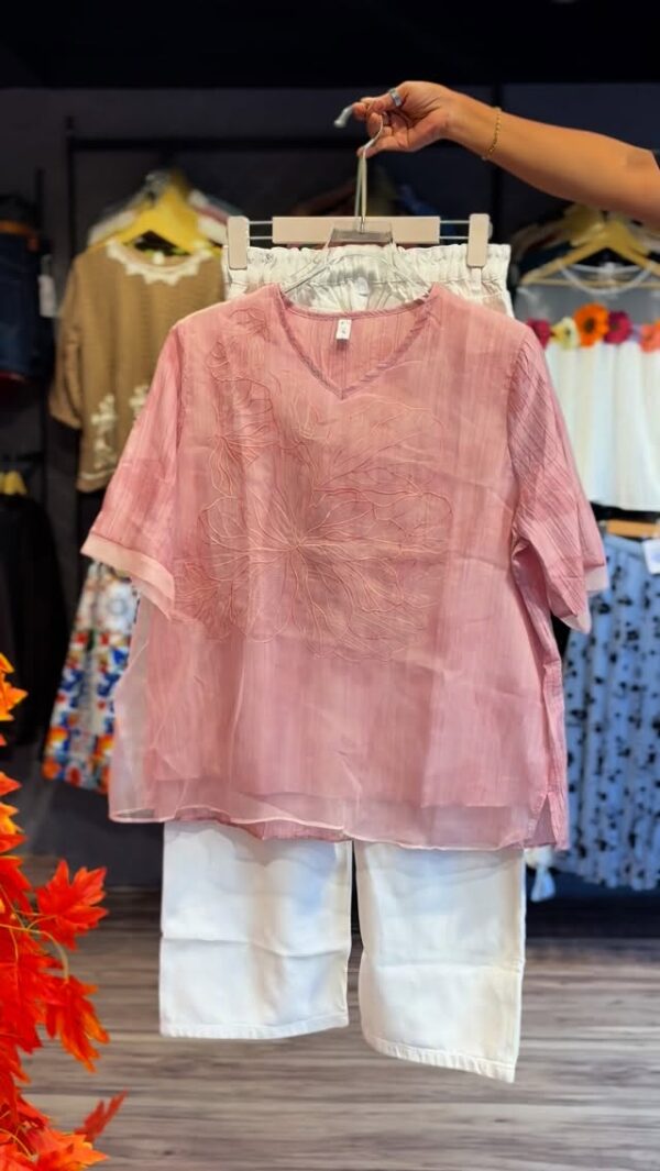 Pretty in Pink: Stylish Top Paired with Chic White Jeans 🌸