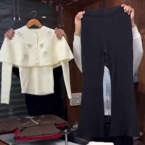 Elegant & Modern – White Ribbed Cardigan with Capelet and Black Flared Trousers